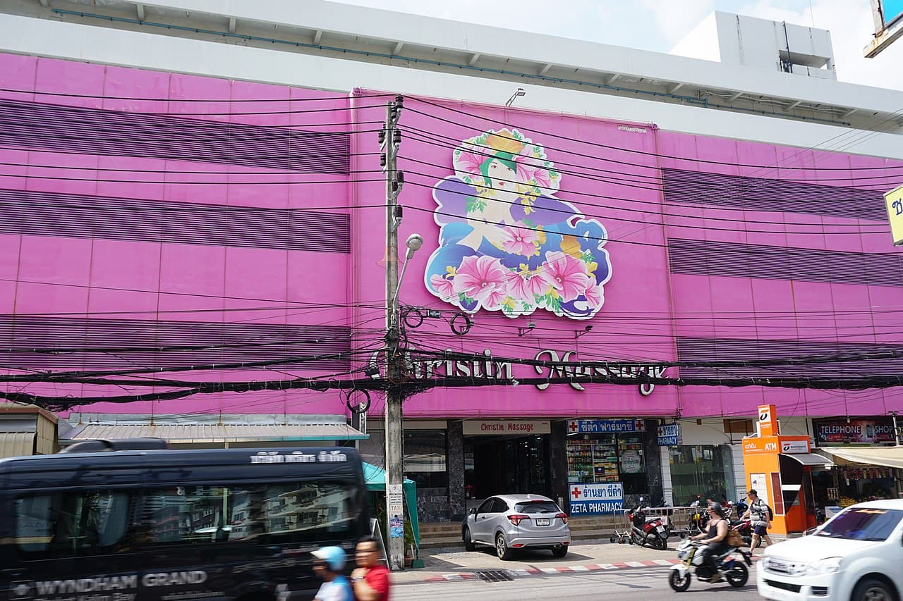 Bangkok street with pharmacy signs ร้านยา ซีต้า and ซีต้า ฟาร์มาซี in Thai script